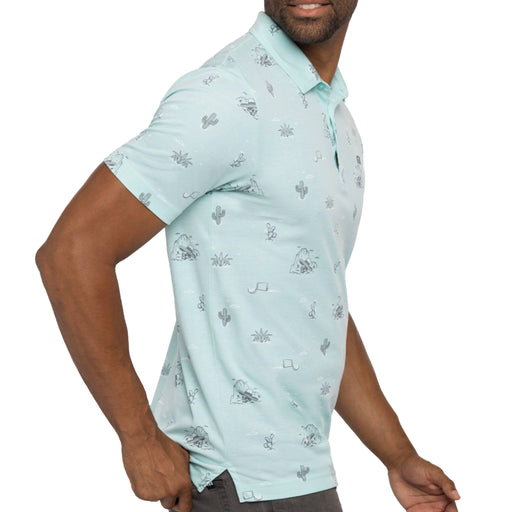 Travis Mathew All The Tacos Polo Shirt in Heather Turquoise. All-over pattern featuring party skeleton, cacti, and agave plants.